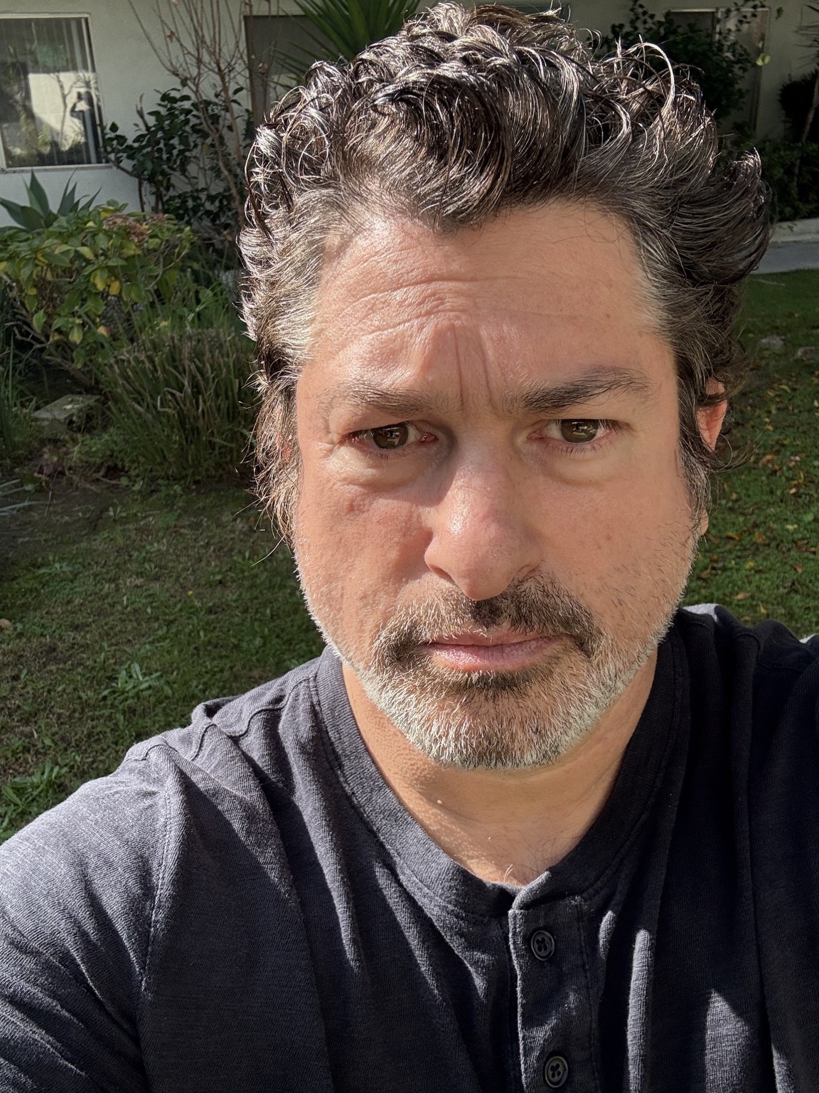 Current portrait of Ronan David outdoors.