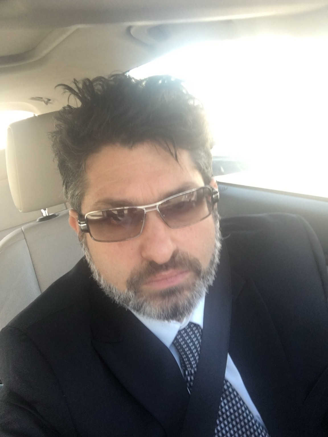 Ronan David in a suit and tie.